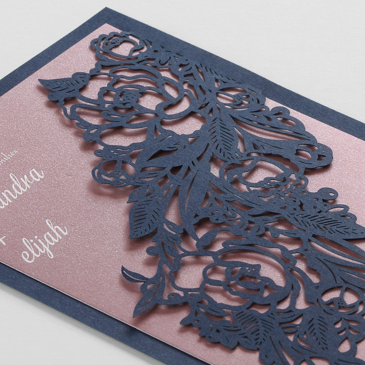 A backer with a laser cut design complements the Cascading Arrangement Invitation