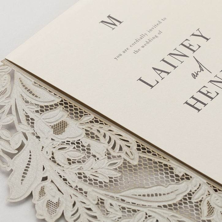 of a luxurious wedding invitation with a lacy laser cut design