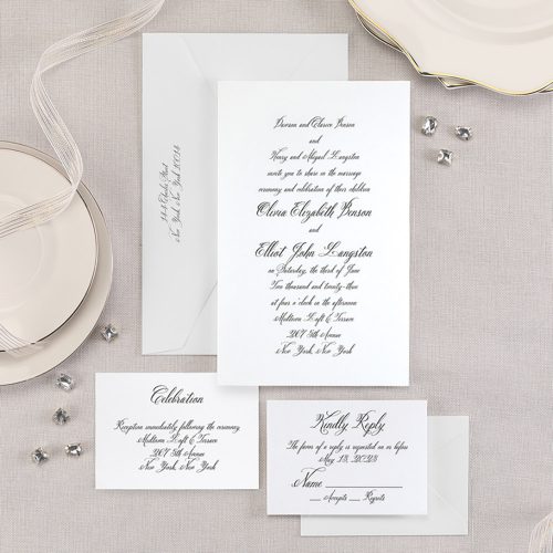 Traditional wedding invitation and enclosures featuring engraved wording