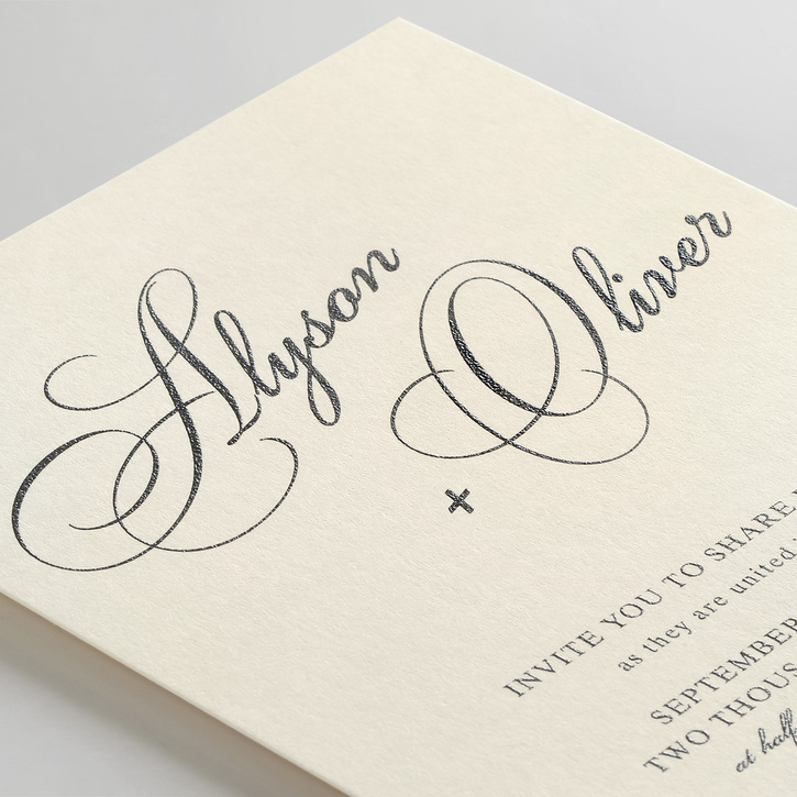 The couple's names appear on a classic wedding invitation in a script font that resembles elegant handwriting