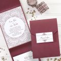 Contemporary pocket wedding invitation featuring a chic medallion design and wording printed in raised thermography ink.