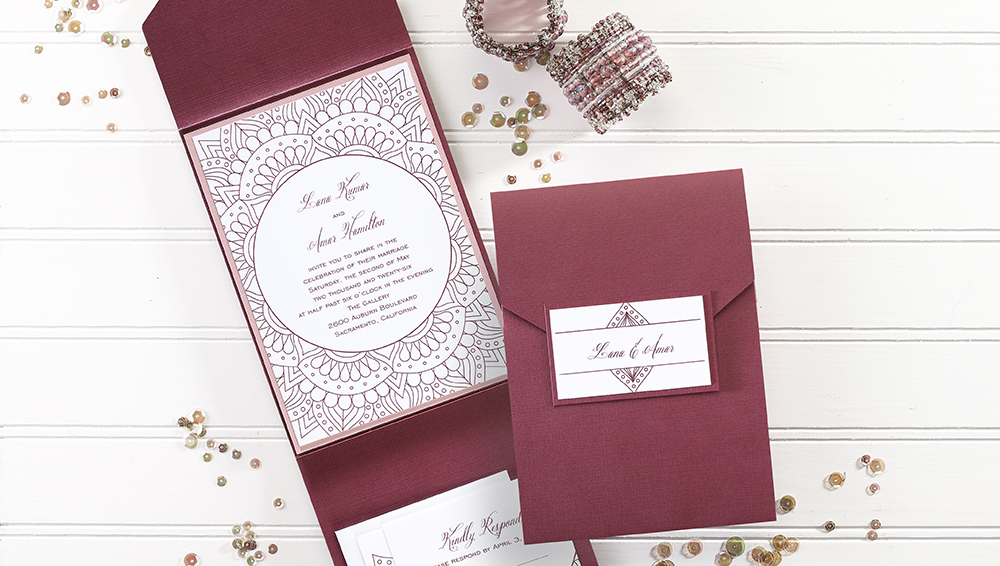 Contemporary pocket wedding invitation featuring a chic medallion design and wording printed in raised thermography ink.