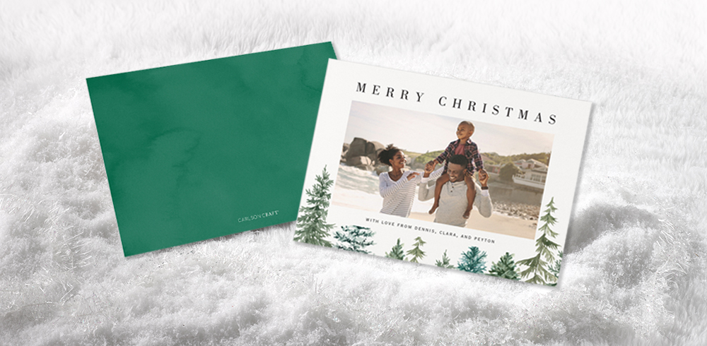 A digitally printed photo holiday card is shown with an evergreen design.