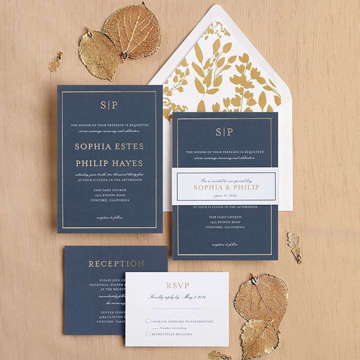 A belly band invitation suite is shown with all the coordinating pieces.