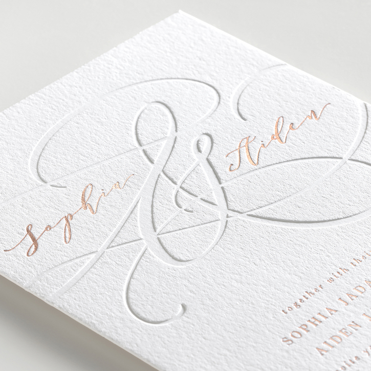 Quality wedding invitation on white textured paper with letterpress ampersand and rose gold foil wording. 