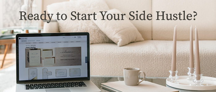 Image of a laptop next to a notebook and coffee at a living room coffee table.